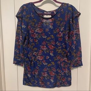 Free people size medium blue floral blouse with ruffle detail on front and back!